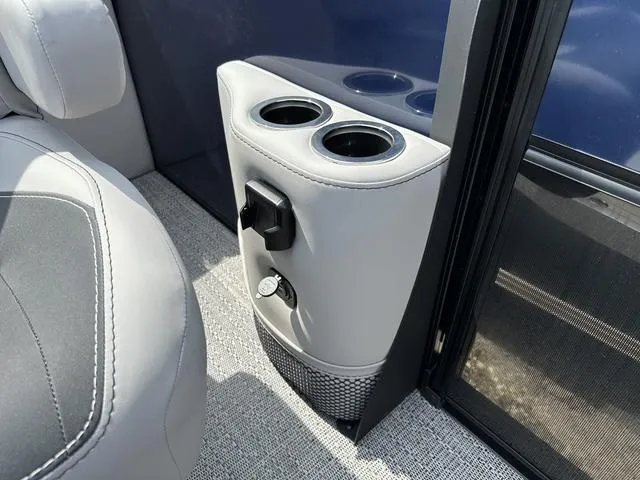 Slide: The Image of Cup holders and controls in 2025 Barletta Boats A22QC interior. - 27
