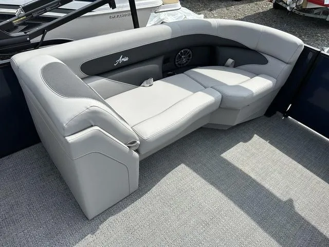 Slide: The Image of 2025 Barletta Boats A22QC interior seating with gray upholstery and speaker. - 30