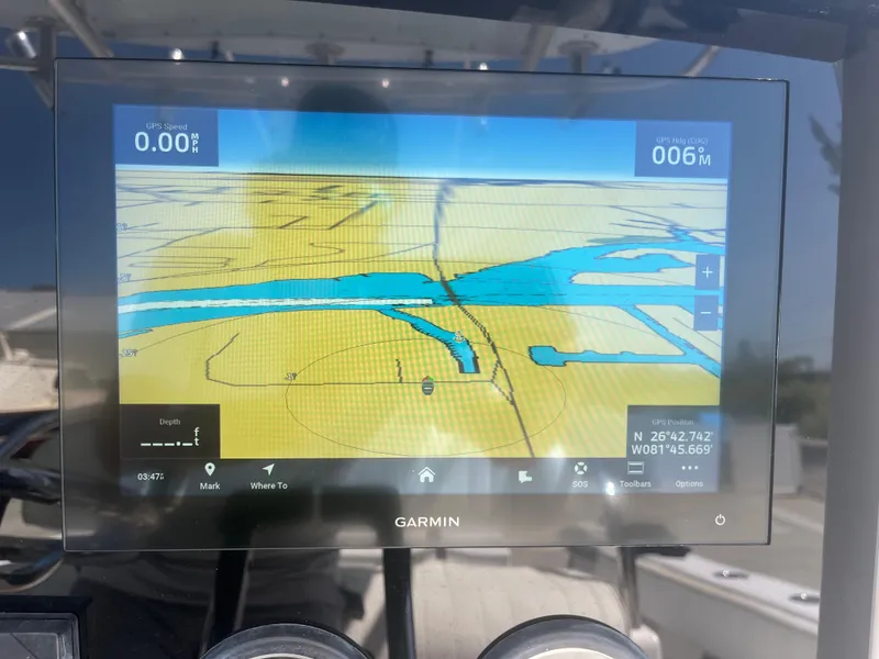 Slide: The Image of Garmin navigation display on 2006 Southport 28 Center Console boat, showing map and coordinates. - 13