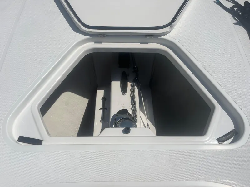 Slide: The Image of Open anchor compartment on 2006 Southport 28 Center Console boat. - 19