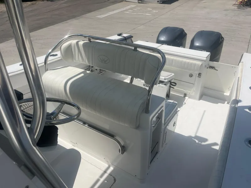 Slide: The Image of 2006 Southport 28 Center Console boat interior with dual engines and white seating. - 21
