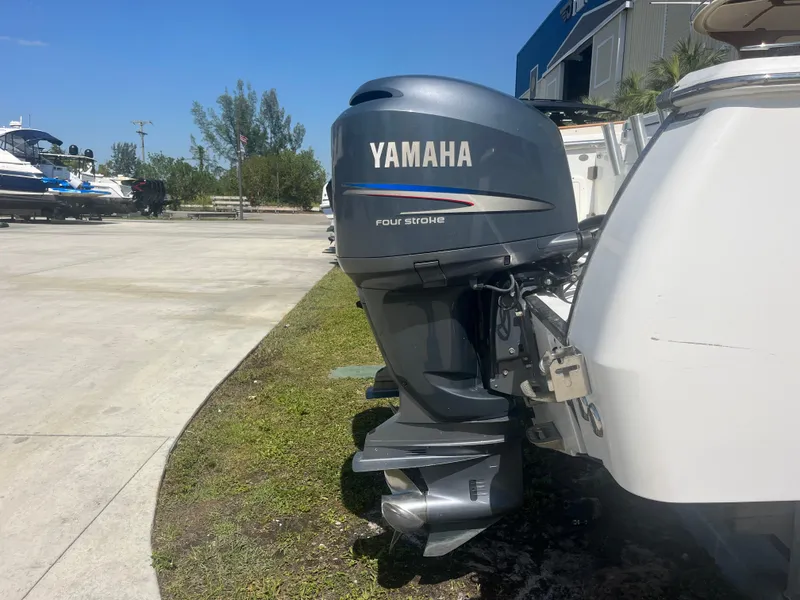 Slide: The Image of Yamaha outboard motor on 2006 Southport 28 Center Console boat, parked outdoors. - 22