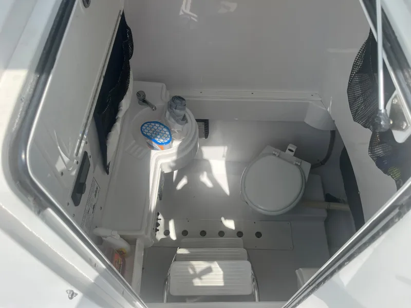 Slide: The Image of Interior view of a 2006 Southport 28 Center Console boat's compact bathroom. - 28