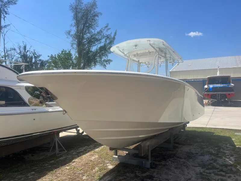 Slide: The Image of 2006 Southport 28 Center Console boat on display outdoors. - 3