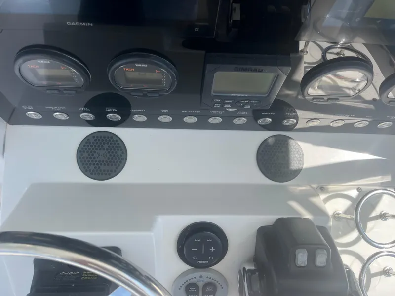 Slide: The Image of Control panel of a 2006 Southport 28 Center Console boat with gauges and controls. - 34