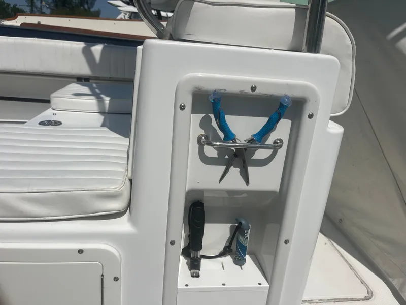 Slide: The Image of 2006 Southport 28 Center Console boat with tool storage and white seating. - 36