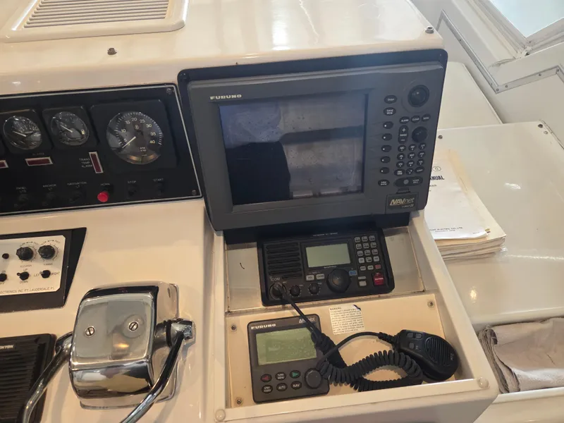 Slide: The Image of Control panel of 1989 Chris-Craft 42 Sportfish Commander with navigation and communication equipment. - 19