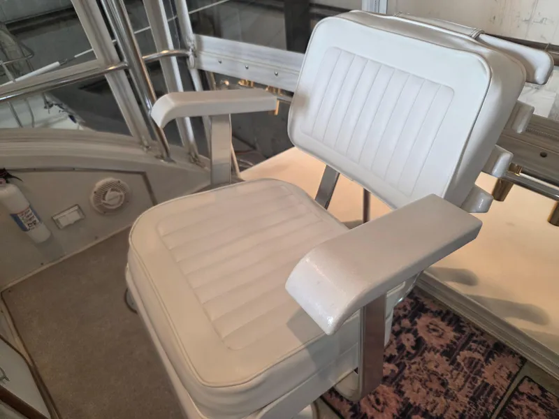 Slide: The Image of White captain's chair on 1989 Chris-Craft 42 Sportfish Commander boat. - 23
