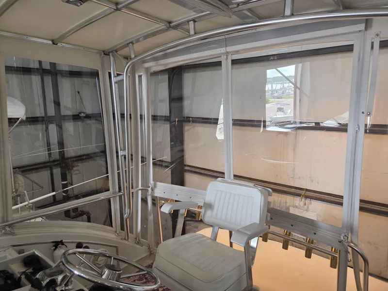 Slide: The Image of 1989 Chris-Craft 42 Sportfish Commander interior with helm and seating. - 29