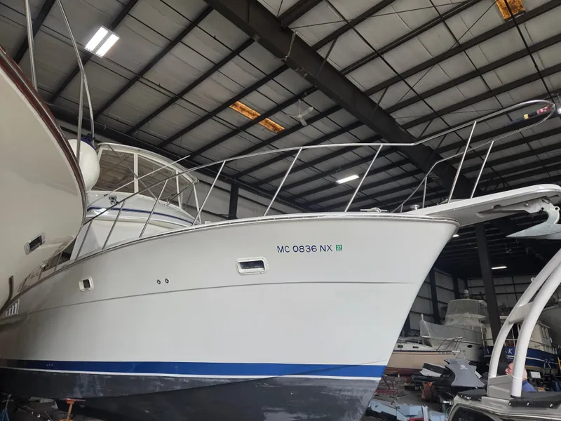 Slide: The Image of 1989 Chris-Craft 42 Sportfish Commander in storage, showcasing sleek design and sturdy build. - 3