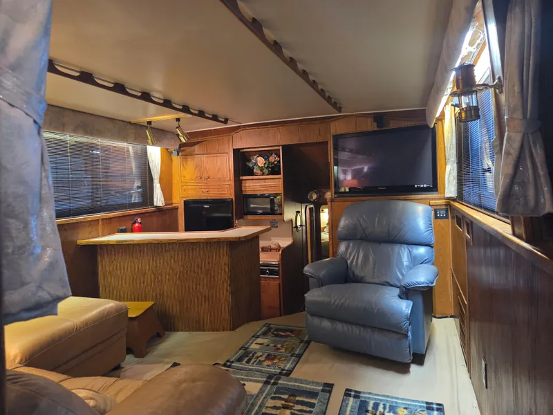 Slide: The Image of Interior of 1989 Chris-Craft 42 Commander Sportfish with cozy seating and modern amenities. - 35