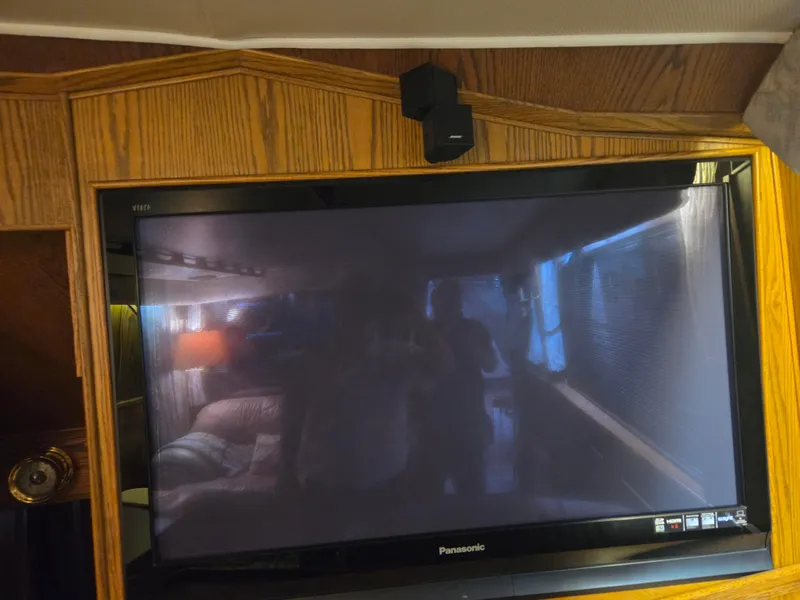 Slide: The Image of Panasonic TV inside 1989 Chris-Craft 42 Sportfish Commander, reflecting interior cabin view. - 37