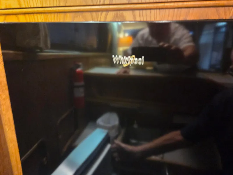 Slide: The Image of Reflection on Whirlpool appliance in 1989 Chris-Craft 42 Commander Sportfish interior. - 44