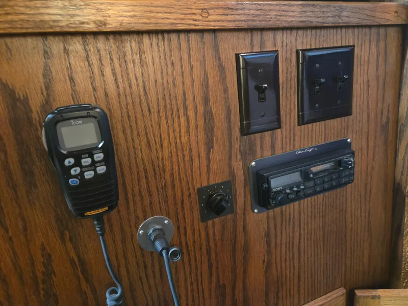 Slide: The Image of Control panel of 1989 Chris-Craft 42 Commander Sportfish with radio and switches. - 48