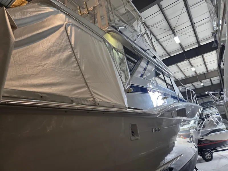 Slide: The Image of 1989 Chris-Craft 42 Sportfish Commander in storage, showcasing sleek design and structure. - 5