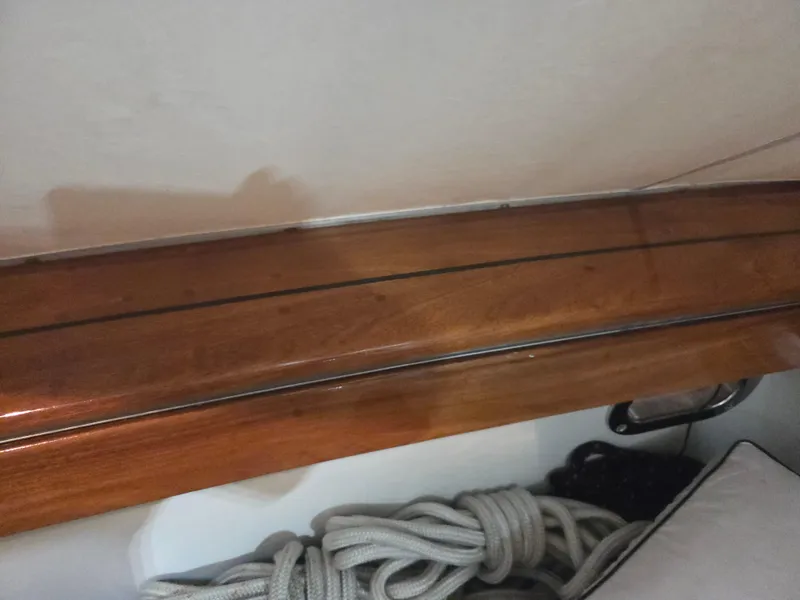 Slide: The Image of 1989 Chris-Craft 42 Sportfish Commander interior with polished wood and coiled rope. - 73