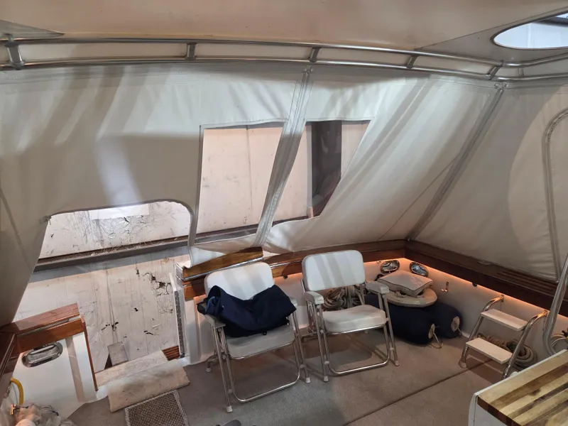 Slide: The Image of Interior of 1989 Chris-Craft 42 Commander Sportfish with chairs and soft lighting. - 74