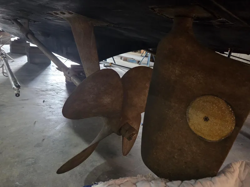 Slide: The Image of Propeller and rudder of 1989 Chris-Craft 42 Sportfish Commander in dry dock. - 78