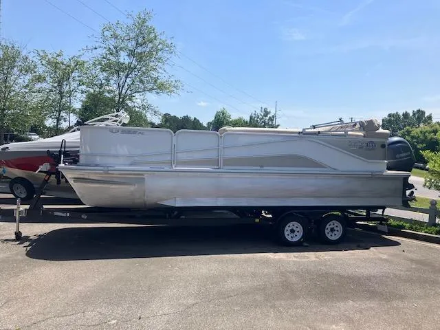 The Image of 2020 G3 SunCatcher V322FC pontoon boat on trailer, parked outdoors. - 0