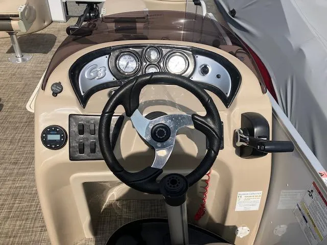 Slide: The Image of Steering console of 2020 G3 SunCatcher V322FC boat with gauges and controls. - 3