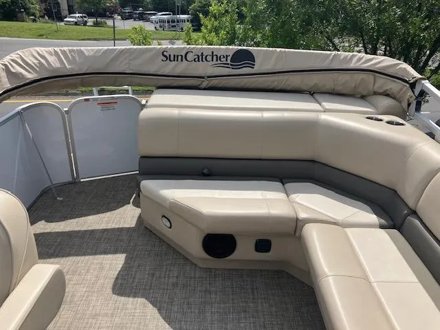 Slide: The Image of 2020 G3 SunCatcher V322FC pontoon boat with beige seating and canopy. - 4