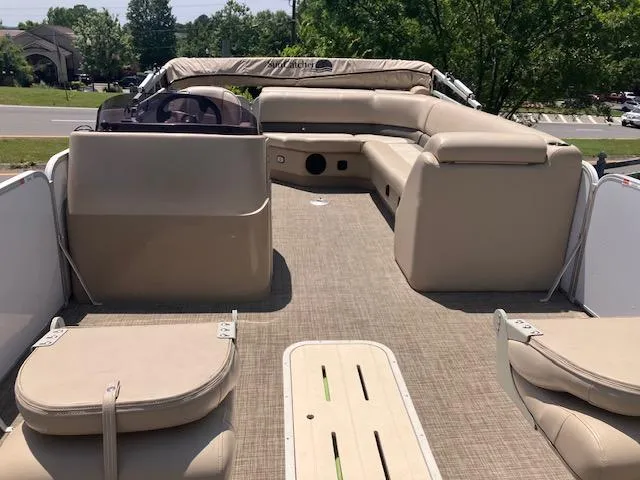 Slide: The Image of 2020 G3 SunCatcher V322FC pontoon boat with beige seating and spacious deck. - 5