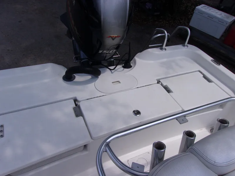Slide: The Image of 2018 Blue Wave 2000 SL boat deck with motor and storage compartments. - 10