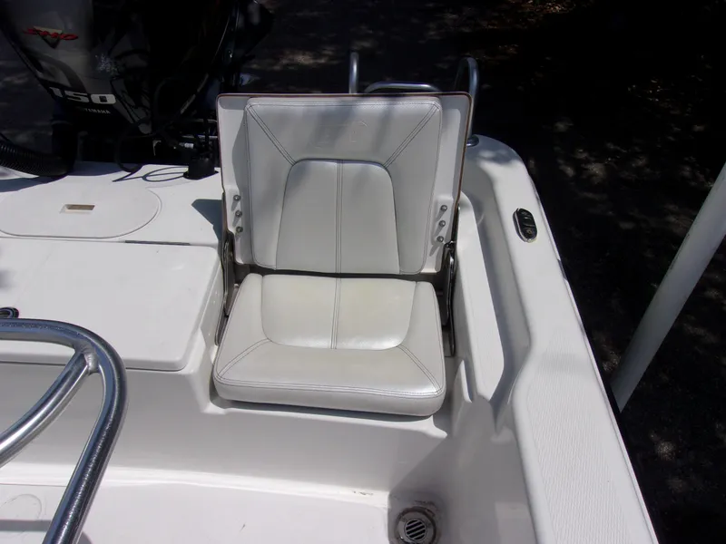 Slide: The Image of White seat on 2018 Blue Wave 2000 SL boat, featuring sleek design and comfortable padding. - 13