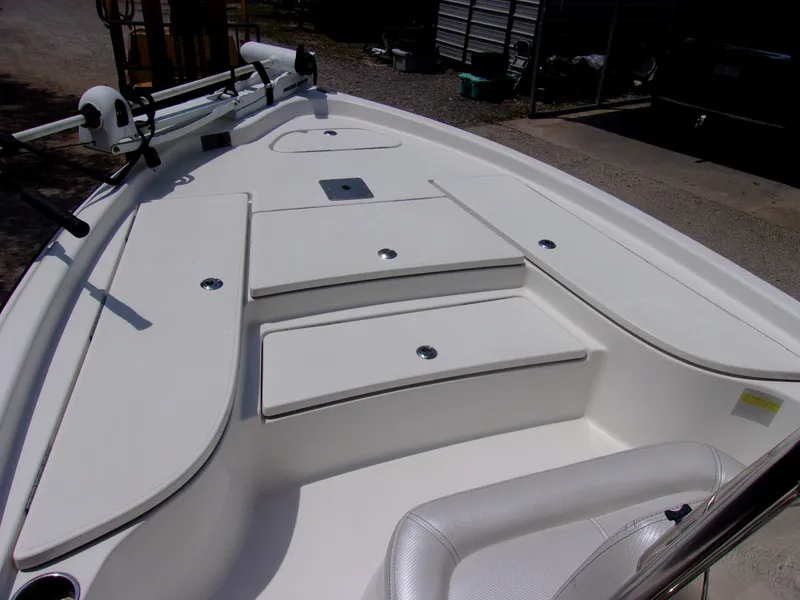 Slide: The Image of 2018 Blue Wave 2000 SL boat deck with storage compartments and seating. - 14