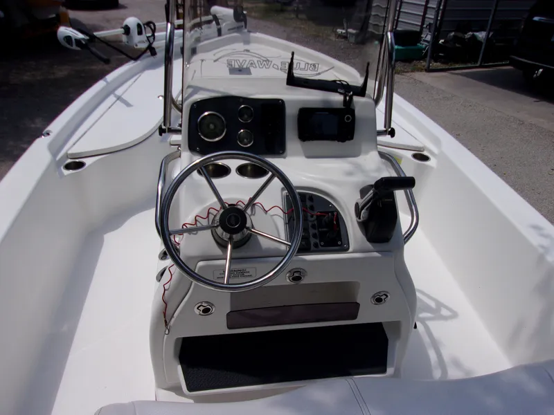 Slide: The Image of 2018 Blue Wave 2000 SL boat console with steering wheel and controls. - 5