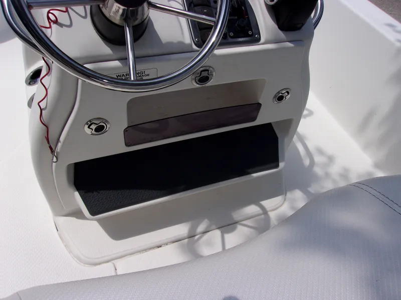 Slide: The Image of Steering console of 2018 Blue Wave 2000 SL boat with stainless steel wheel. - 6