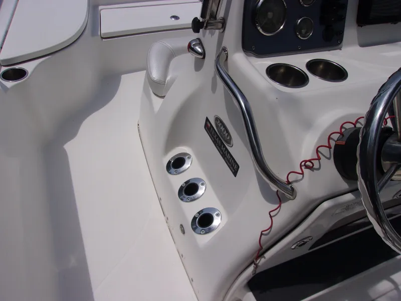 Slide: The Image of Interior of 2018 Blue Wave 2000 SL boat, featuring steering wheel and control panel. - 7