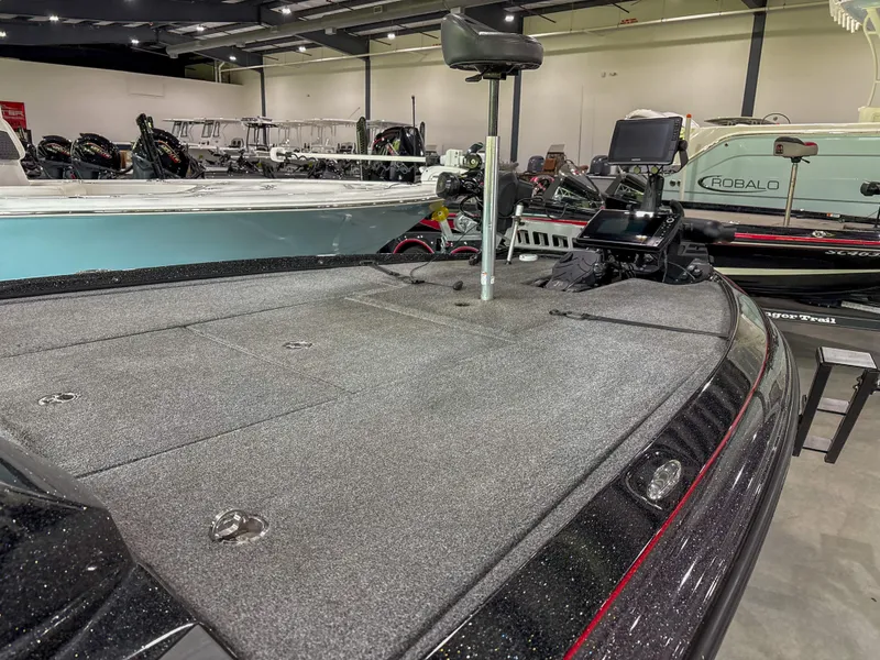 Slide: The Image of Falcon F21 2020 boat deck in showroom, featuring fishing seat and equipment. - 9