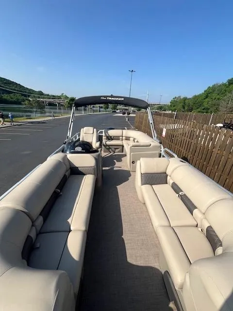 Slide: The Image of 2023 Sun Tracker Party Barge 20 DLX pontoon boat with spacious seating and canopy. - 2