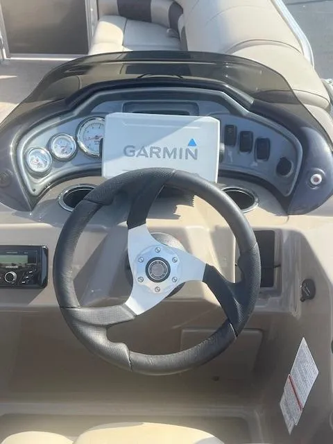 Slide: The Image of 2023 Sun Tracker Party Barge 20 DLX dashboard with Garmin navigation system. - 3