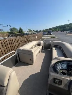 Slide: The Image of 2023 Sun Tracker Party Barge 20 DLX pontoon boat with spacious seating and modern dashboard. - 7