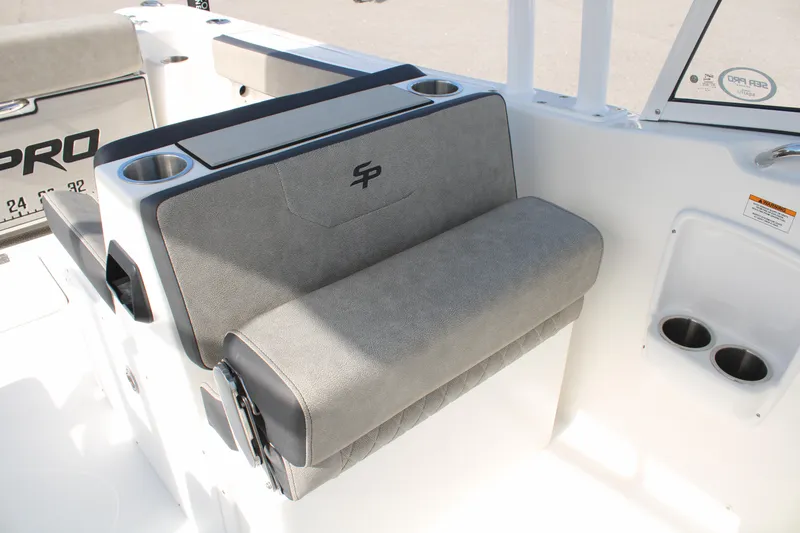 Slide: The Image of 2024 Sea Pro 240 boat seat with cup holders and storage compartment. - 17