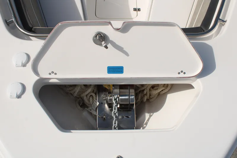 Slide: The Image of 2024 Sea Pro 240 boat anchor storage compartment with chain and rope. - 22