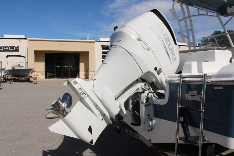 Slide: The Image of 2024 Sea Pro 240 boat with Suzuki outboard motor in a dealership lot. - 3