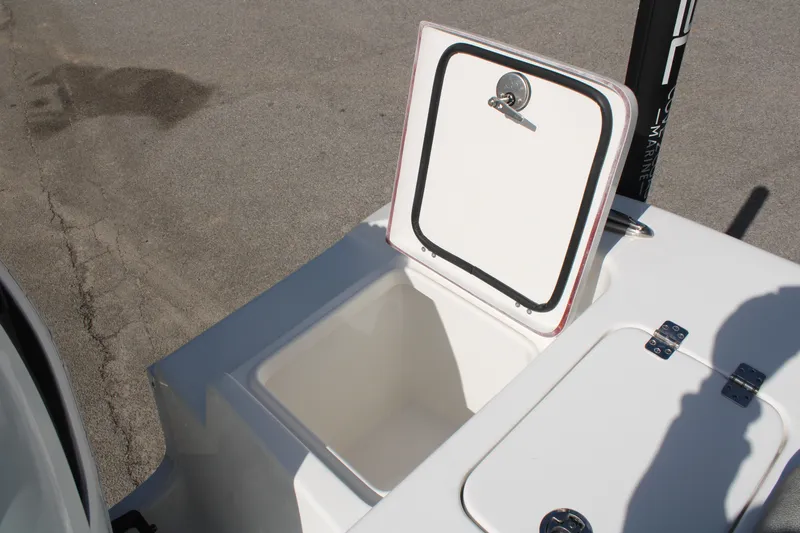 Slide: The Image of 2024 Sea Pro 240 boat storage compartment with open hatch, showcasing interior space. - 8