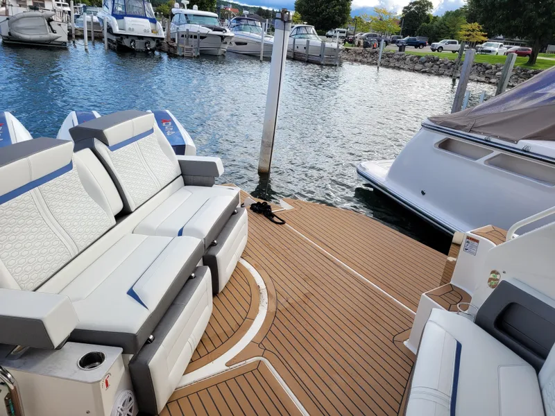 Slide: The Image of Luxury Tiara Sport 43LE 2021 boat with elegant seating at a marina. - 12