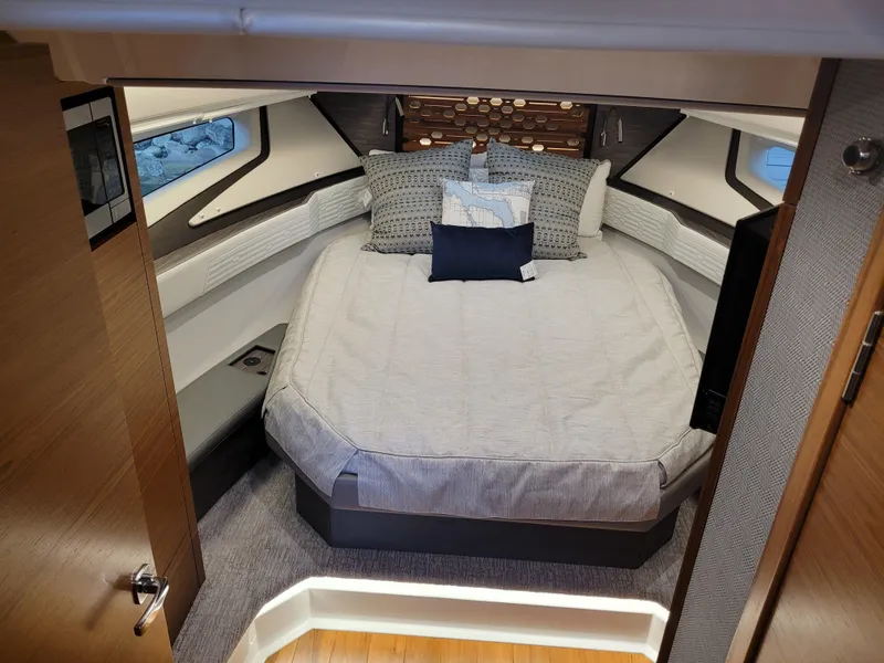 Slide: The Image of Luxurious cabin interior of 2021 Tiara Sport 43 LE yacht with cozy bedding. - 25