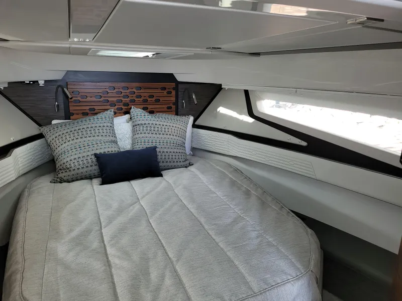 Slide: The Image of Luxurious cabin interior of 2021 Tiara Sport 43LE yacht with elegant bedding. - 26