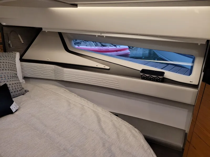 Slide: The Image of Interior cabin of 2021 Tiara Sport 43LE yacht with modern design and window view. - 27
