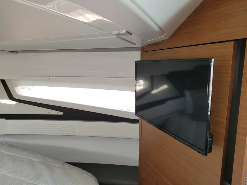 Slide: The Image of Interior of 2021 Tiara Sport 43LE yacht with mounted flat-screen TV. - 29