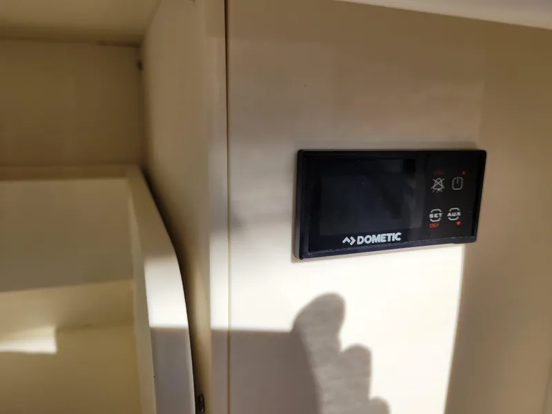 Slide: The Image of Dometic control panel in 2021 Tiara Sport 43LE boat interior. - 31
