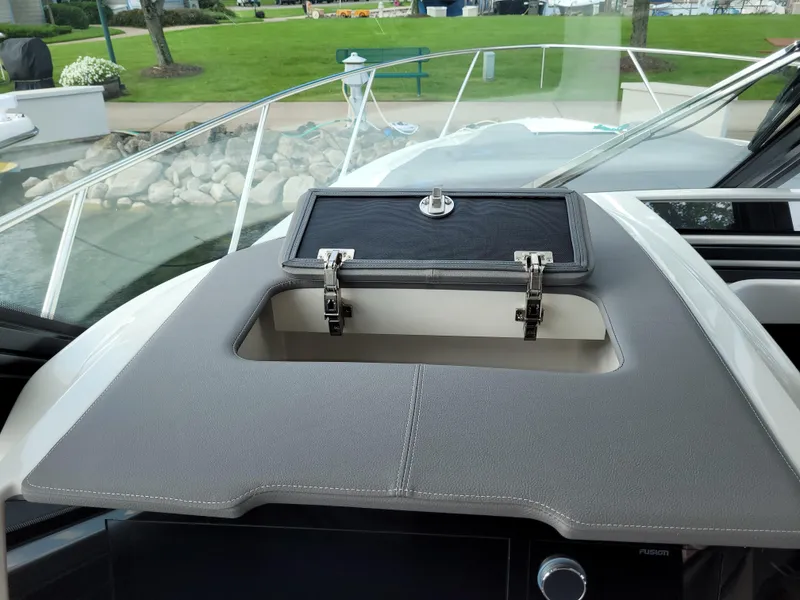 Slide: The Image of Dashboard storage compartment on a 2021 Tiara Sport 43LE boat. - 41