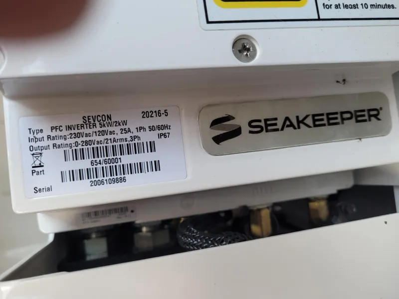 Slide: The Image of Seakeeper device label on Tiara Sport 43LE 2021, showing specifications and serial number. - 43