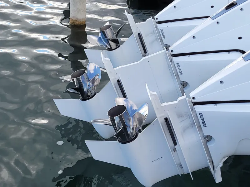 Slide: The Image of Outboard engines of a 2021 Tiara Sport 43LE boat in water. - 8