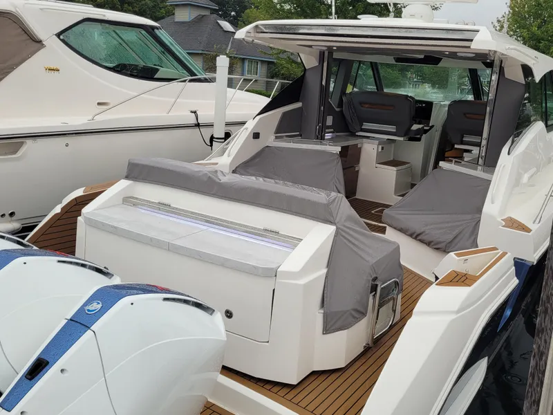 Slide: The Image of 2021 Tiara Sport 43LE luxury boat with sleek design and spacious seating area. - 9